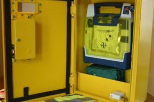 Inside the box is a portable defibrillator (the door is alarmed!)